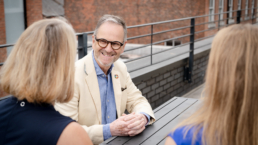 Photo Richard Colley talking to 2 people